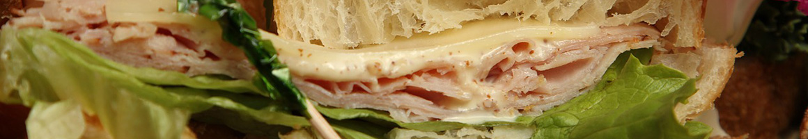 Eating Mediterranean Sandwich at John's Gyros restaurant in Foley, AL.